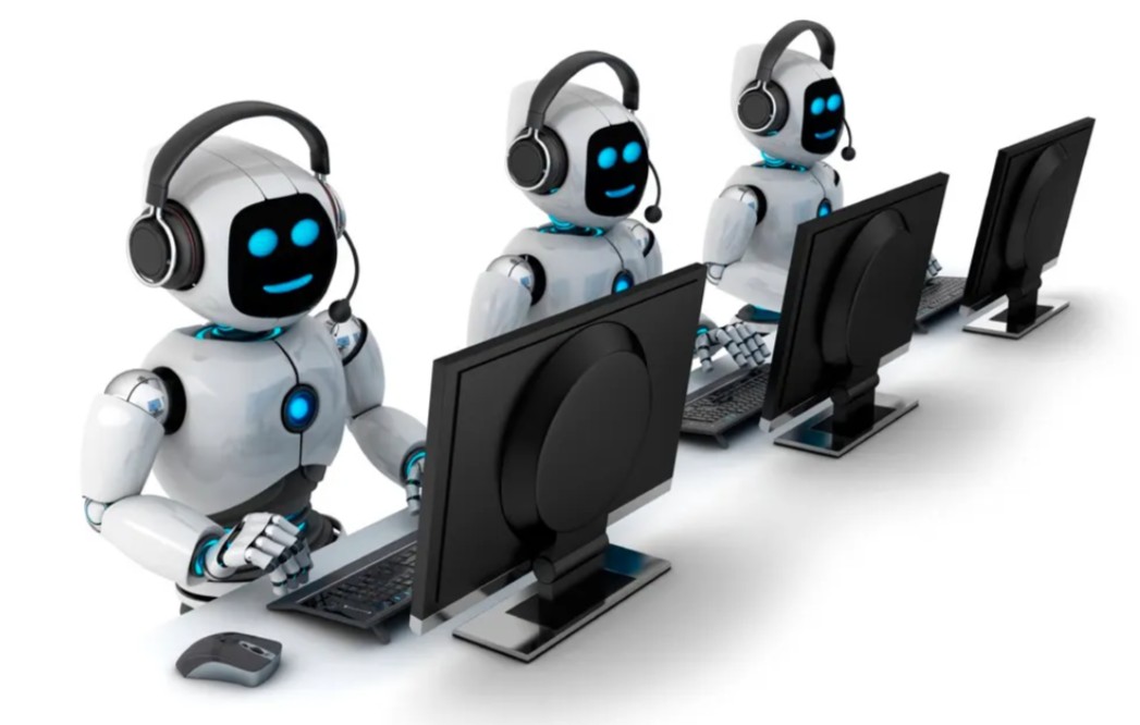 Three friendly AI support robots with headsets at desks, representing AI customer care and voice agents.